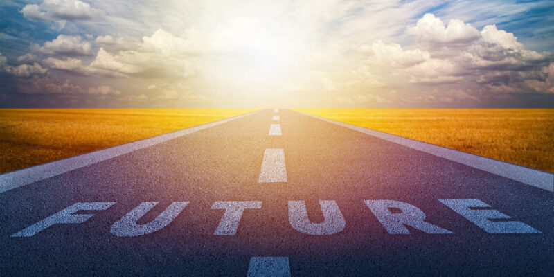 Future on the road in the middle of asphalt road with at sunset forward. Business target and growth strategy concept